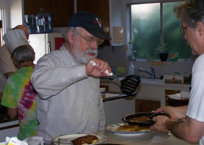 Greg dishes it out whiel Chef Bob tends the batter