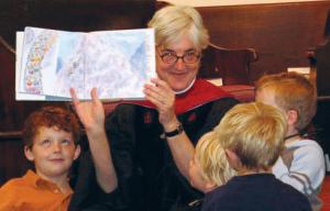 Photo of Judith reading to kids